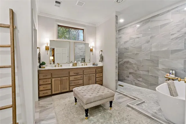 a bathroom with a granite countertop sink a mirror and a bathtub