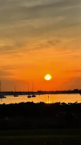 a view of ocean and sunset