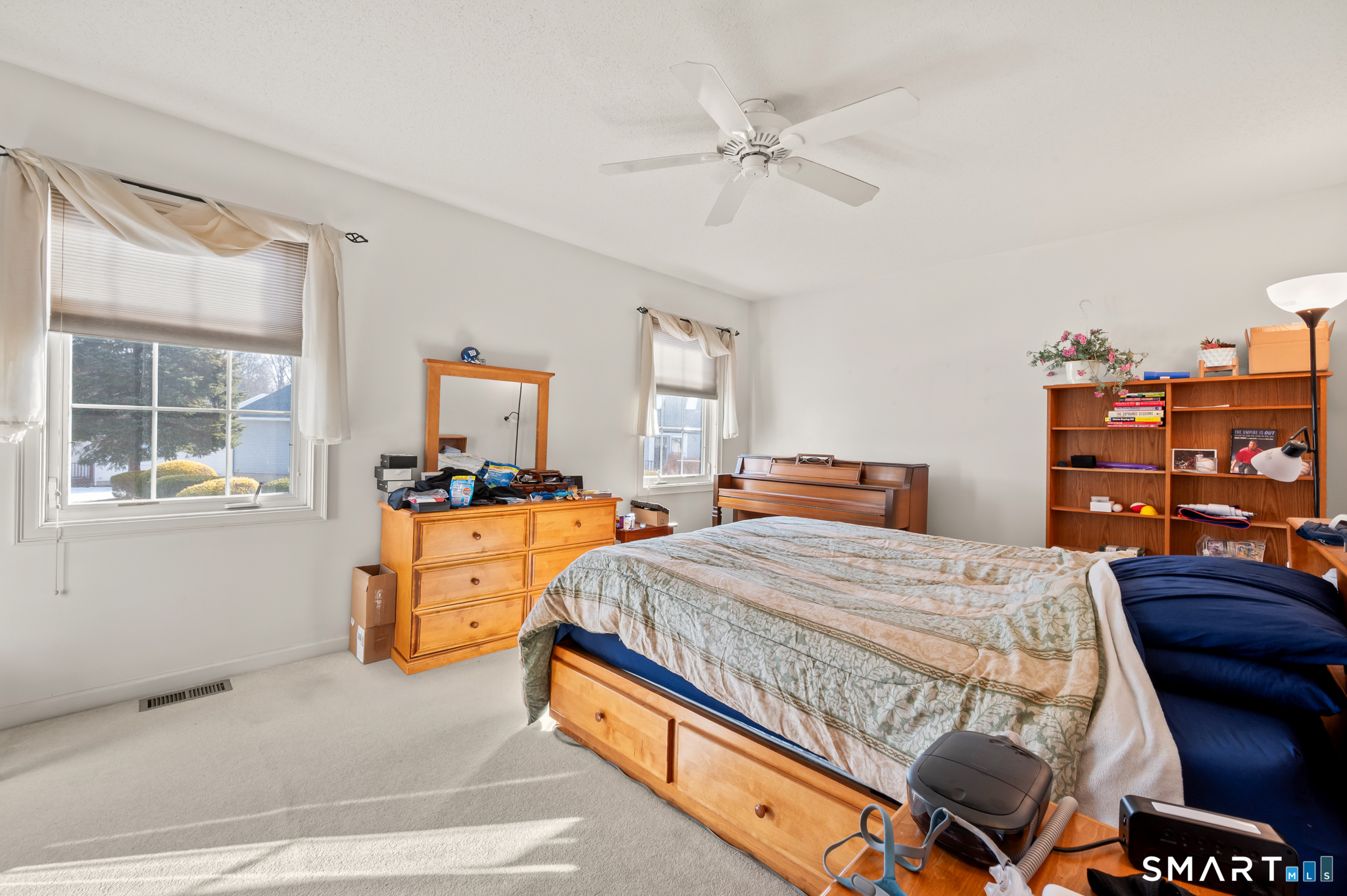 117 Dibble Hollow Lane, Unit 117 Windsor Locks, CT 06096 - Photo 14 of 34 a bed room with a bed and a dresser