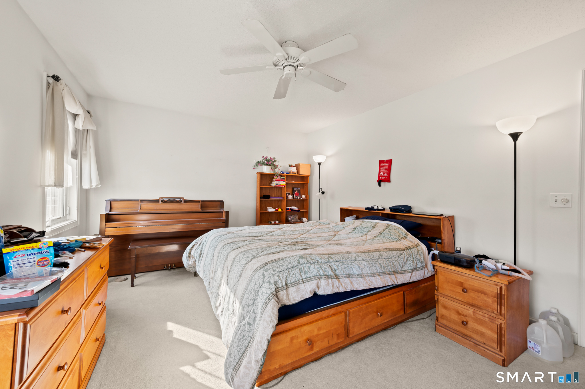 117 Dibble Hollow Lane, Unit 117 Windsor Locks, CT 06096 - Photo 15 of 34 a bed room with a bed and dresser