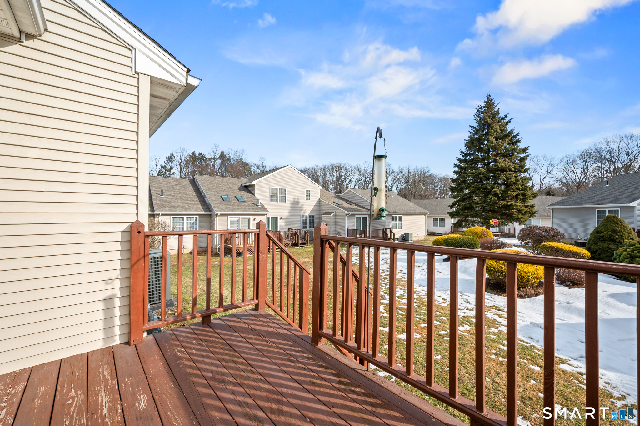 117 Dibble Hollow Lane, Unit 117 Windsor Locks, CT 06096 - Photo 32 of 34 a view of a balcony with wooden floor and fence