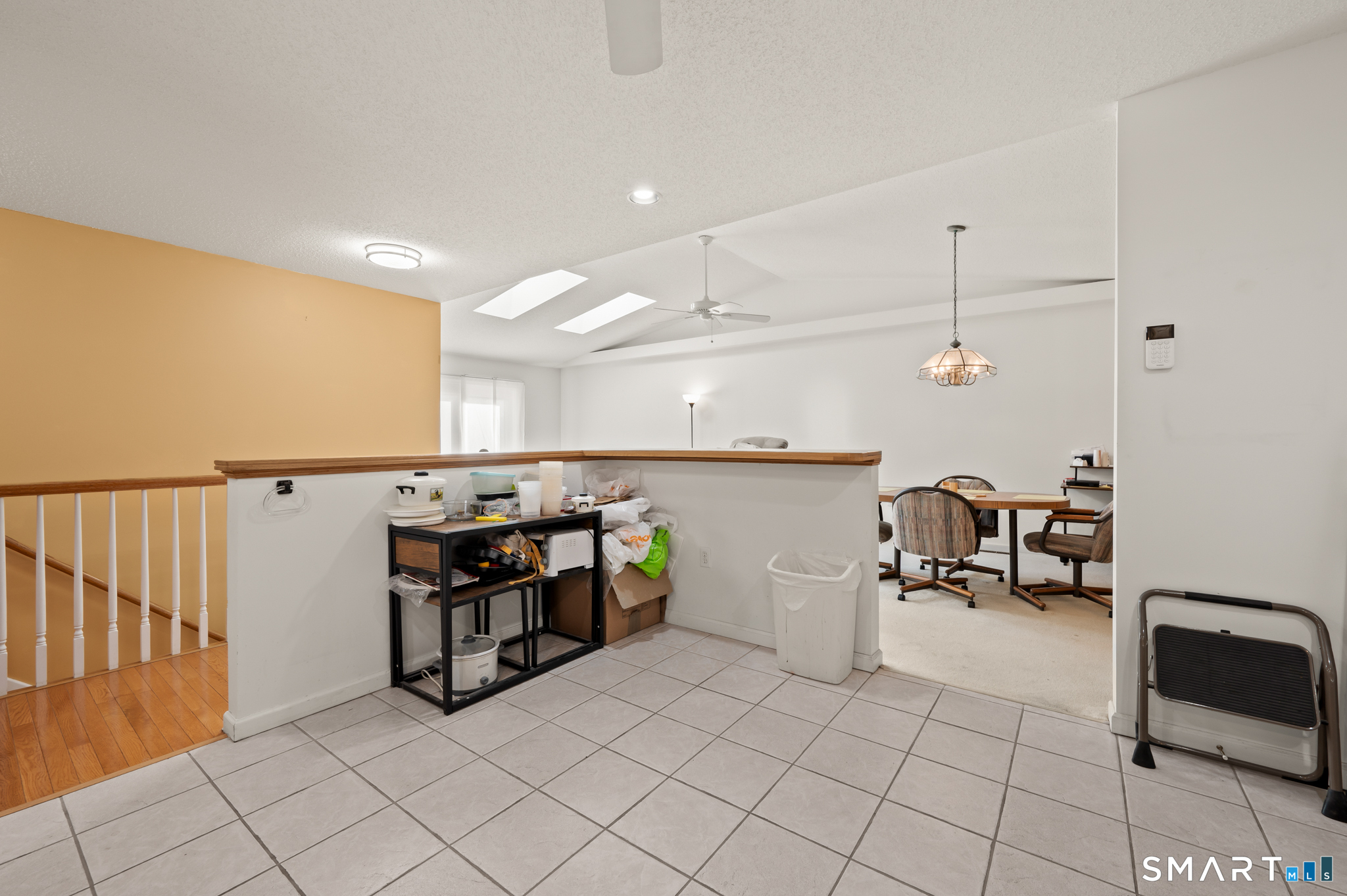 117 Dibble Hollow Lane, Unit 117 Windsor Locks, CT 06096 - Photo 4 of 34 a kitchen with stainless steel appliances kitchen island granite countertop a sink and cabinets