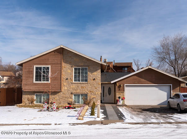 780 Cedar Court Rifle, CO 81650 - Photo 1 of 31 a front view of a house with a yard