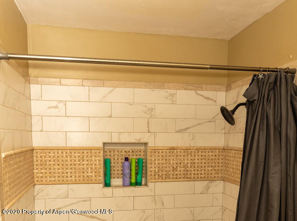 780 Cedar Court Rifle, CO 81650 - Photo 11 of 31 a bathroom with a shower