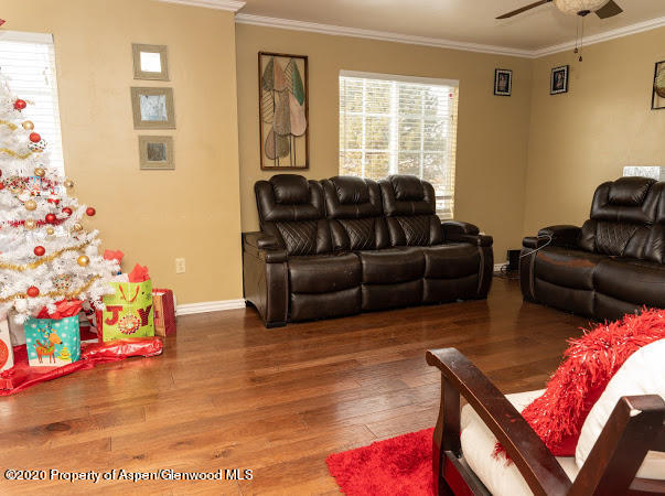 780 Cedar Court Rifle, CO 81650 - Photo 13 of 31 a living room with furniture and flowers