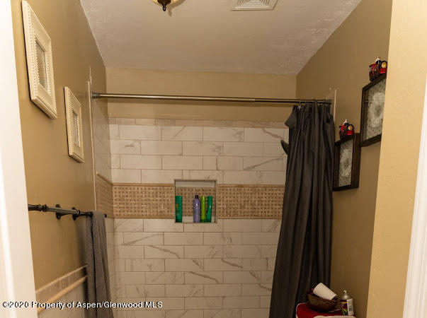 780 Cedar Court Rifle, CO 81650 - Photo 14 of 31 a bathroom with a shower