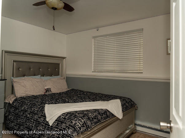 780 Cedar Court Rifle, CO 81650 - Photo 20 of 31 a bedroom with a bed and a window