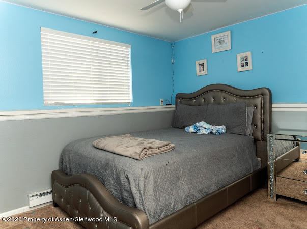 780 Cedar Court Rifle, CO 81650 - Photo 25 of 31 a bedroom with a bed and a window