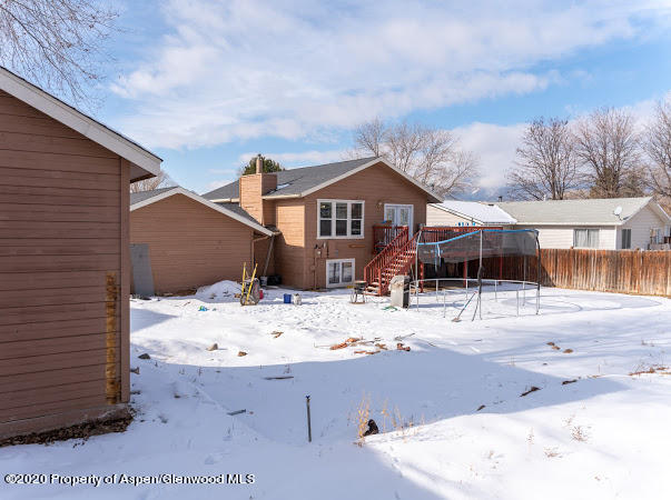 780 Cedar Court Rifle, CO 81650 - Photo 28 of 31 a view of a house with a snow