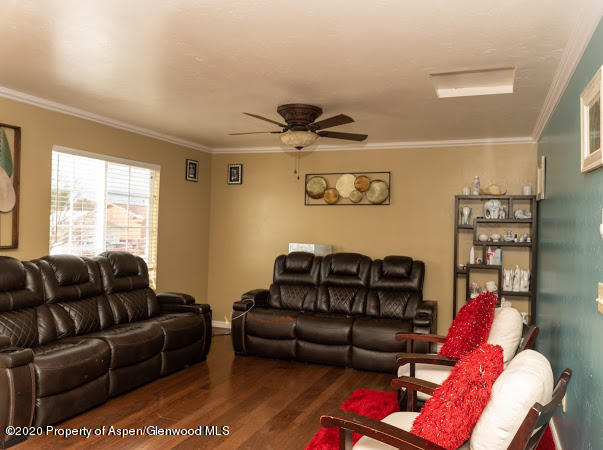 780 Cedar Court Rifle, CO 81650 - Photo 3 of 31 a living room with furniture a couch and a window