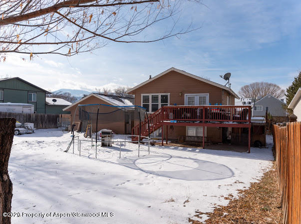 780 Cedar Court Rifle, CO 81650 - Photo 31 of 31 a view of a house with a snow in the background