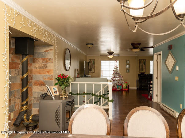 780 Cedar Court Rifle, CO 81650 - Photo 4 of 31 a living room with fireplace furniture and a flat screen tv
