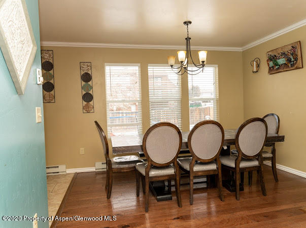 780 Cedar Court Rifle, CO 81650 - Photo 8 of 31 a view of a dining room with furniture window and wooden floor