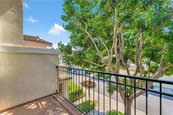 a view of a balcony with a tree