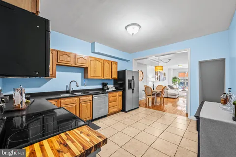 a bedroom with furniture and a flat tv screen