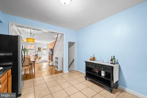 a view of a bedroom with bed and wooden floor