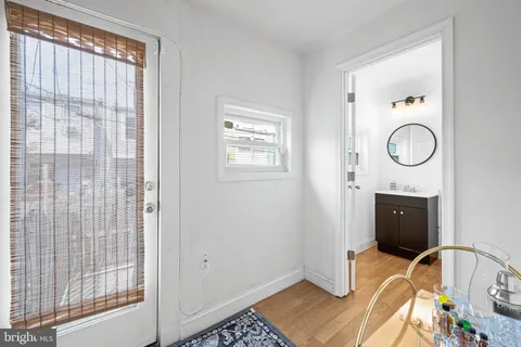 a view of a door and chair in a room
