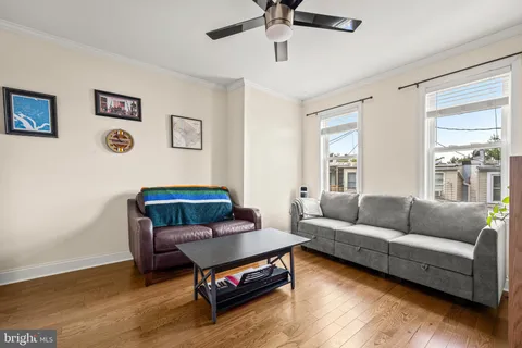 a view of a house with a wooden fence