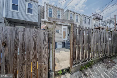 a front view of a house with a outdoor space