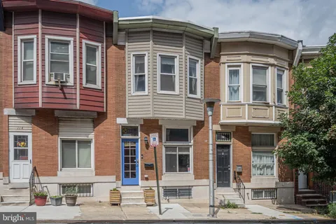 a front view of a house with street