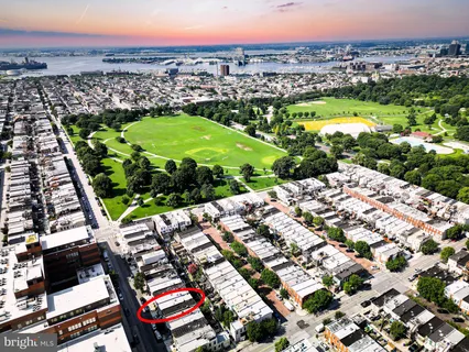 a front view of a residential apartment building with a yard