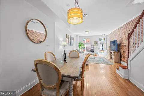 a kitchen with stainless steel appliances a refrigerator sink and cabinets