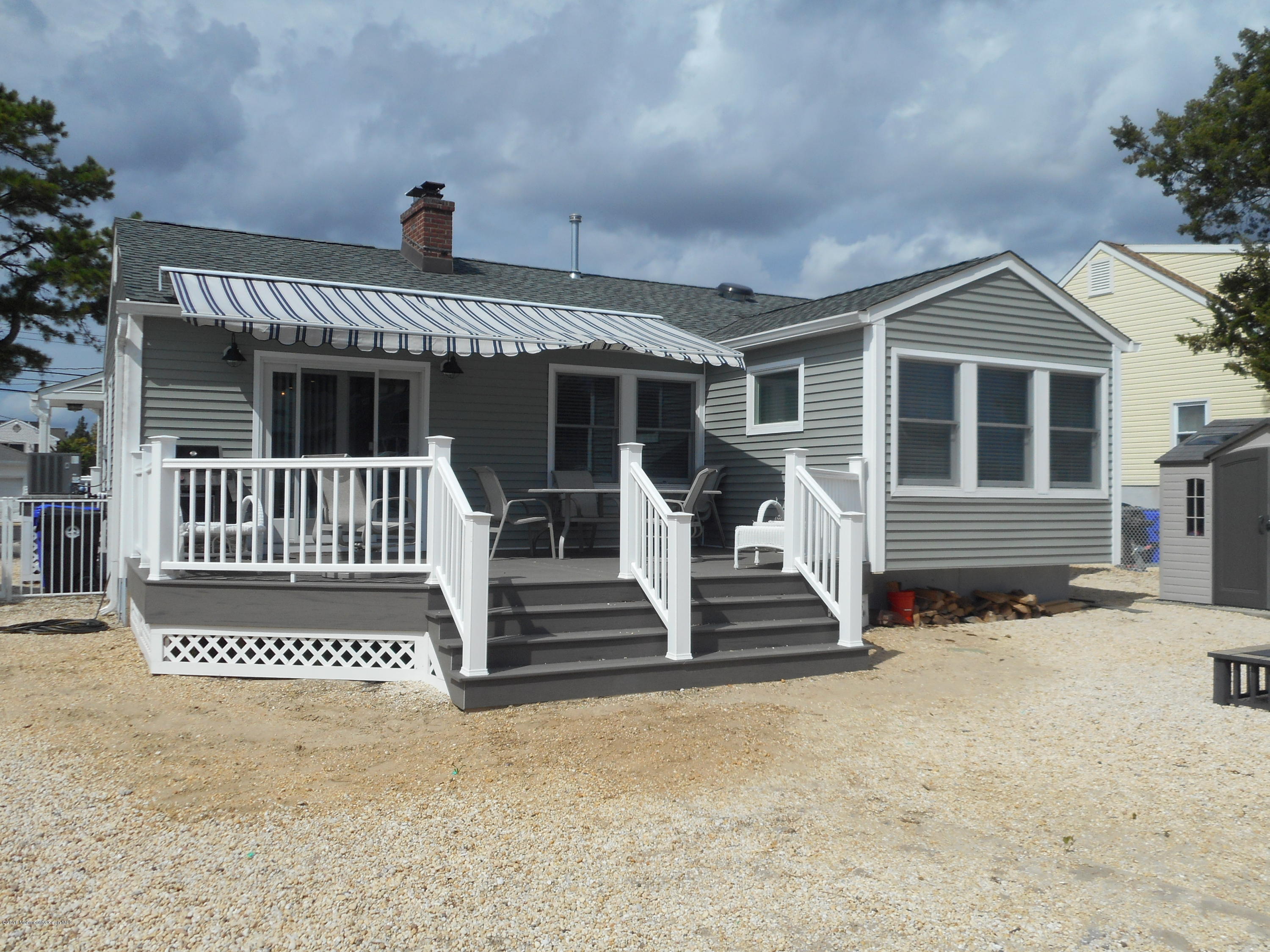 712 Drum Point Road Brick, NJ 08723 - Photo 1 of 23 a front view of a house with stairs