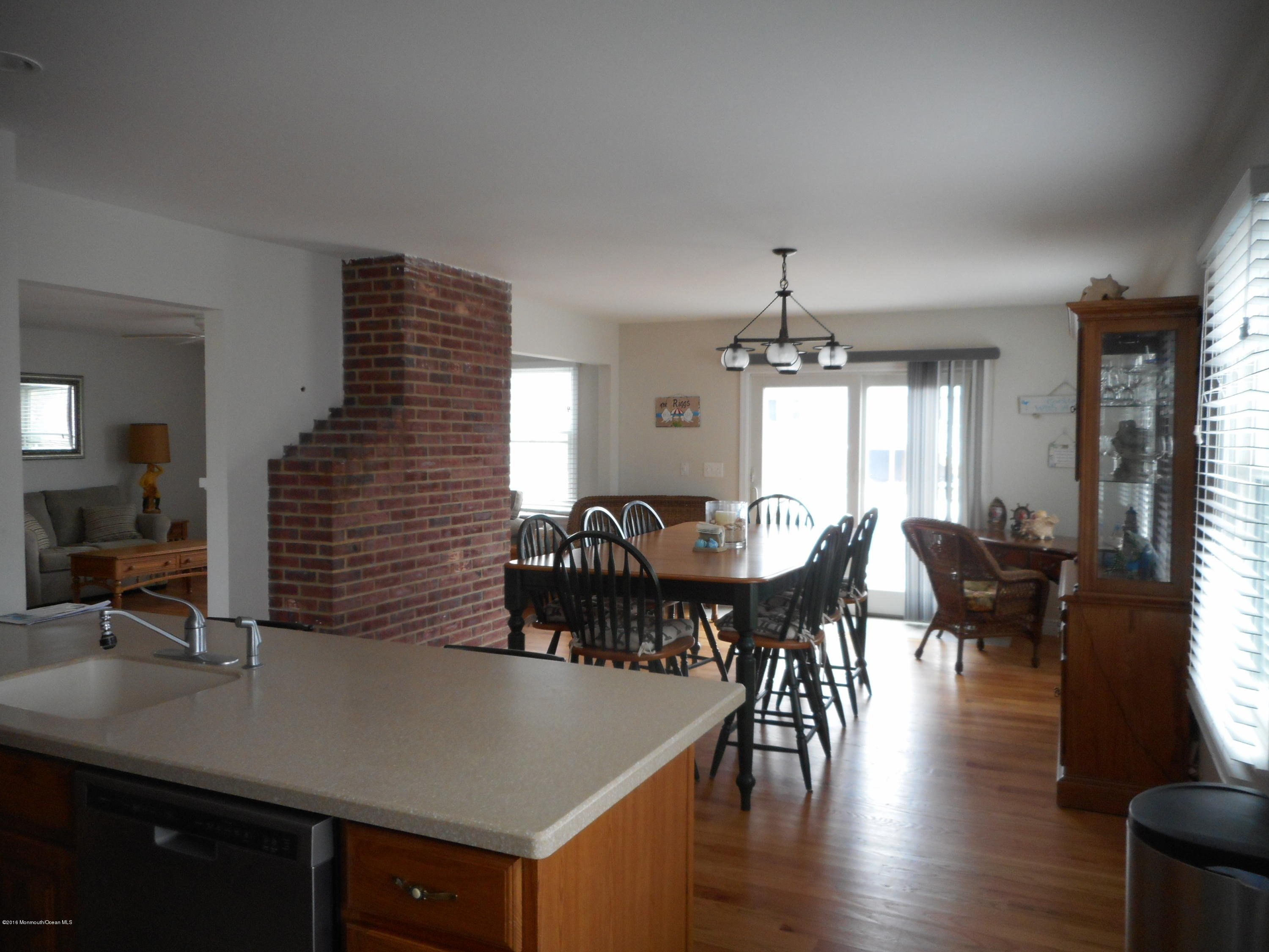 712 Drum Point Road Brick, NJ 08723 - Photo 14 of 23 a view of a a dining room with furniture window and wooden floor