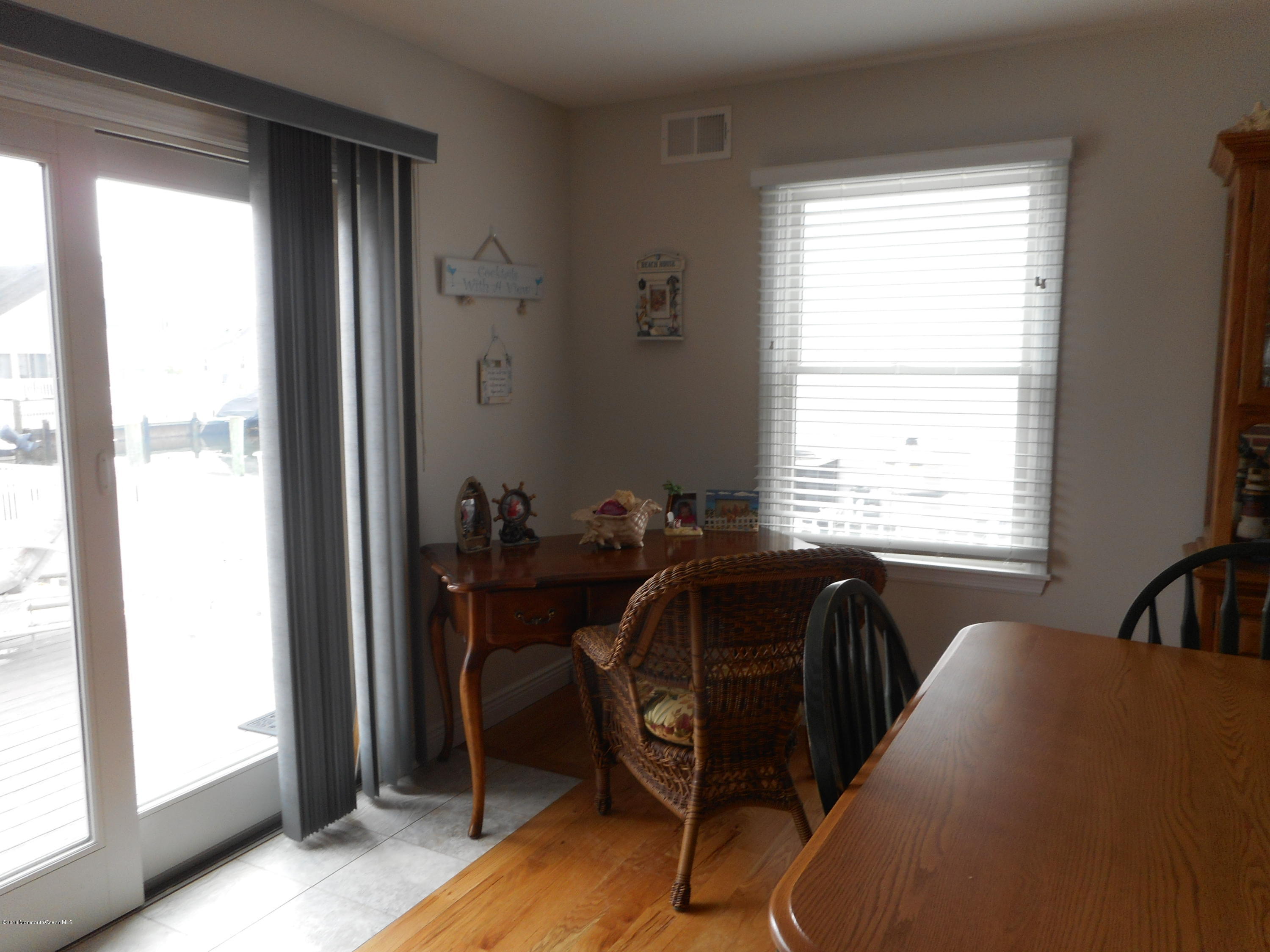 712 Drum Point Road Brick, NJ 08723 - Photo 15 of 23 a view of a workspace with furniture and a window