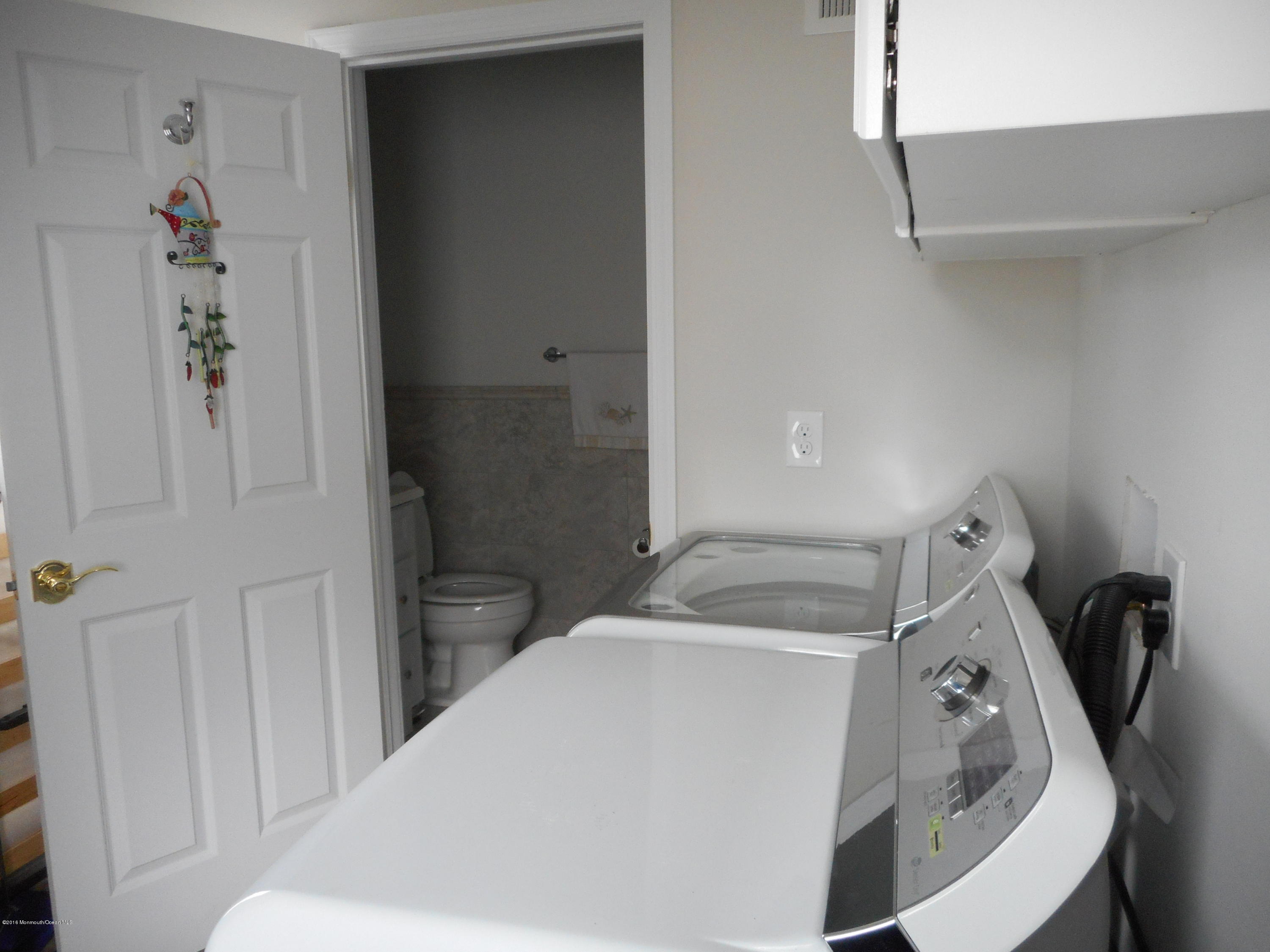 712 Drum Point Road Brick, NJ 08723 - Photo 19 of 23 a bathroom with a sink and toilet