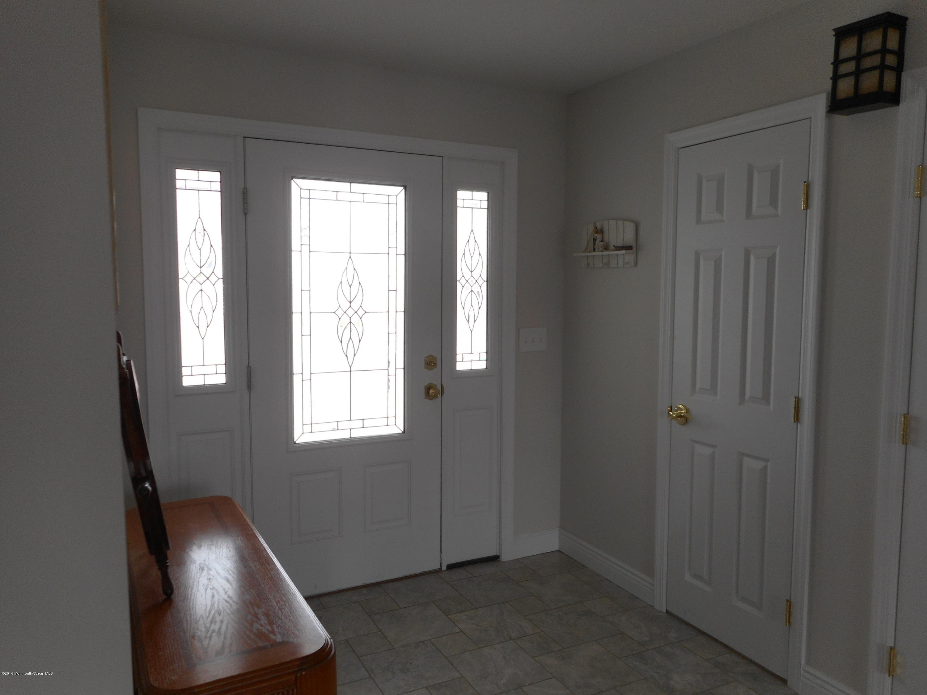 712 Drum Point Road Brick, NJ 08723 - Photo 5 of 23 a view of an entryway and a window