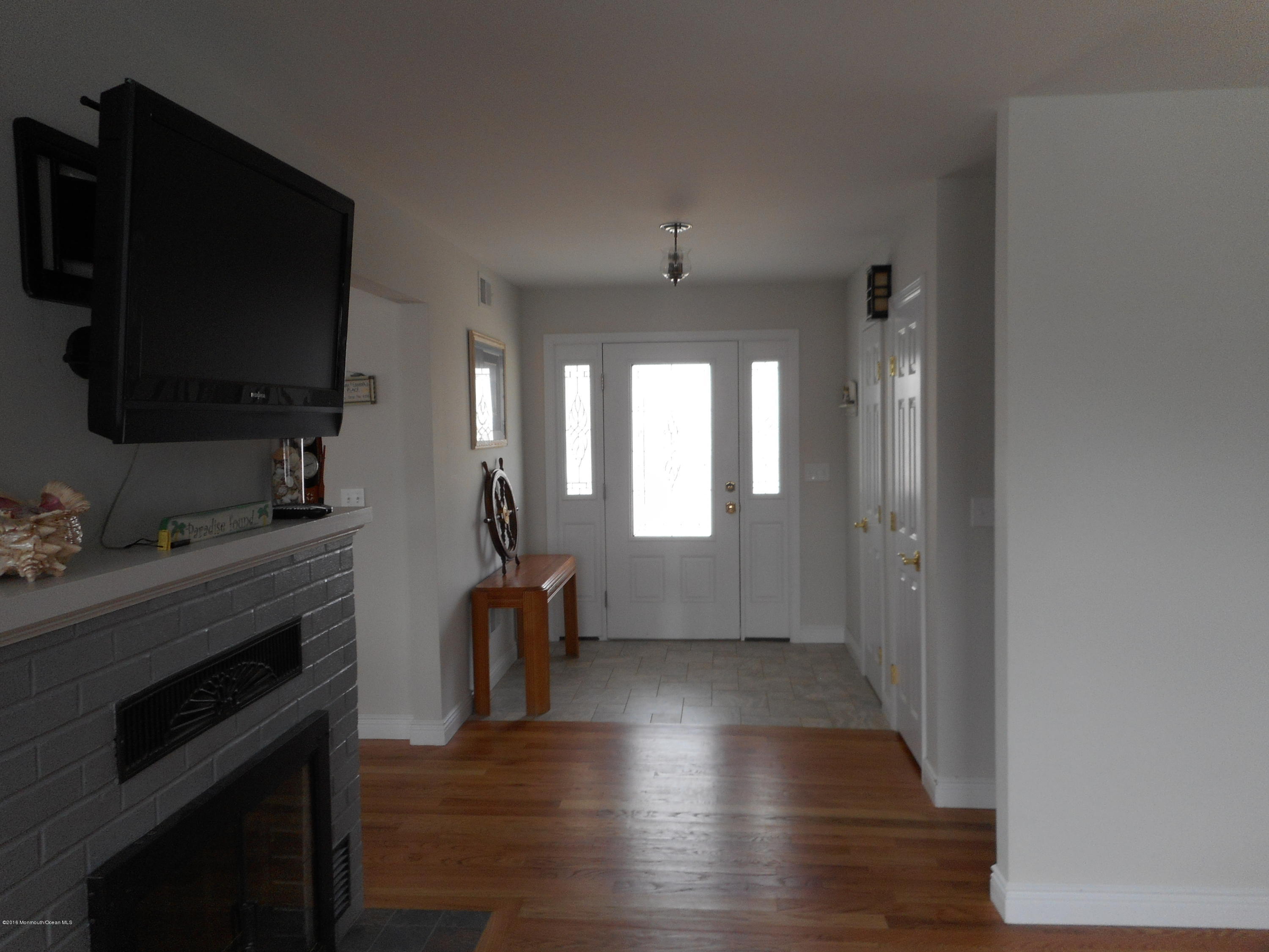 712 Drum Point Road Brick, NJ 08723 - Photo 6 of 23 a view of a livingroom with furniture and a flat screen tv
