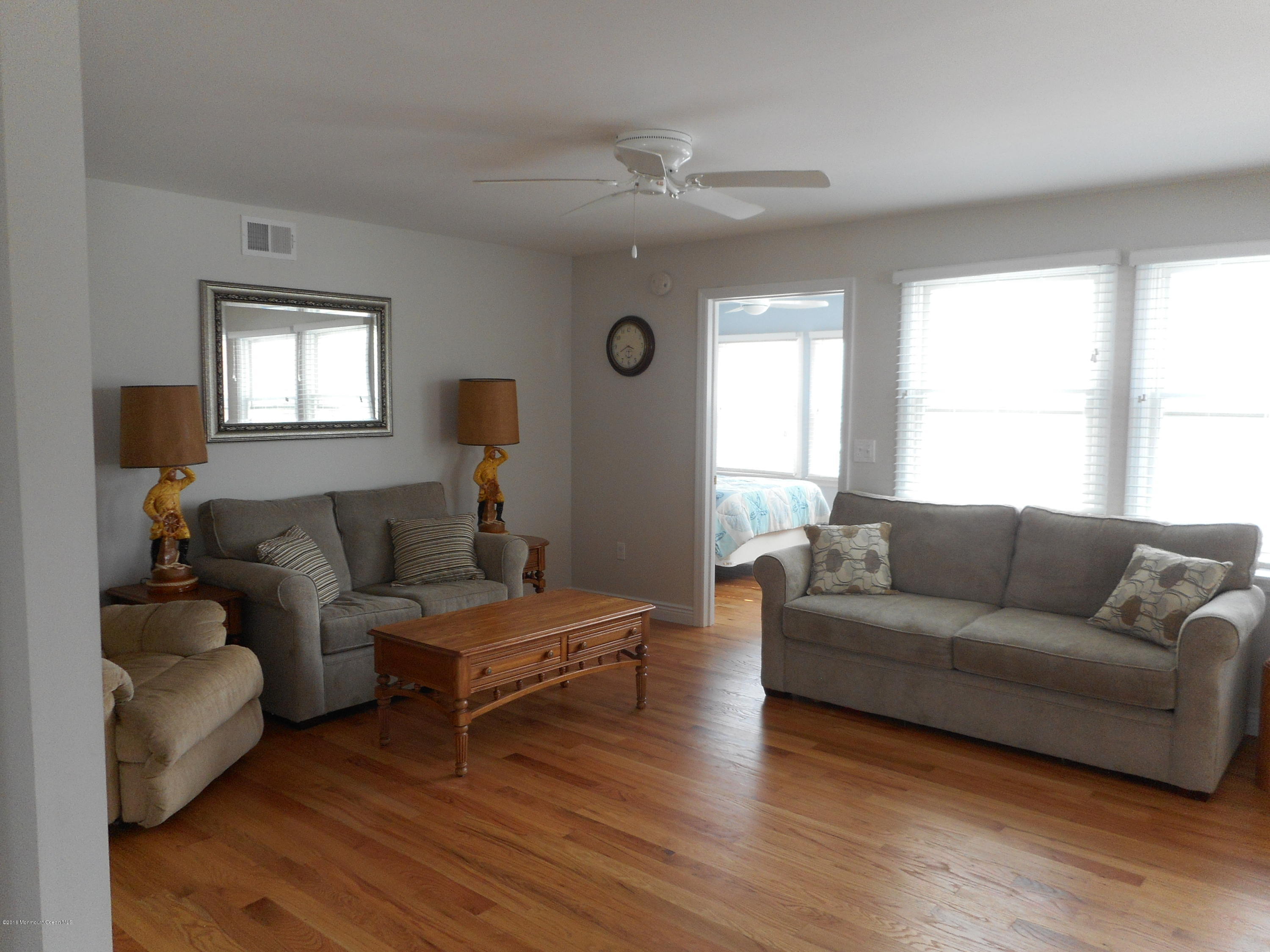 712 Drum Point Road Brick, NJ 08723 - Photo 7 of 23 a living room with furniture and a wooden floor