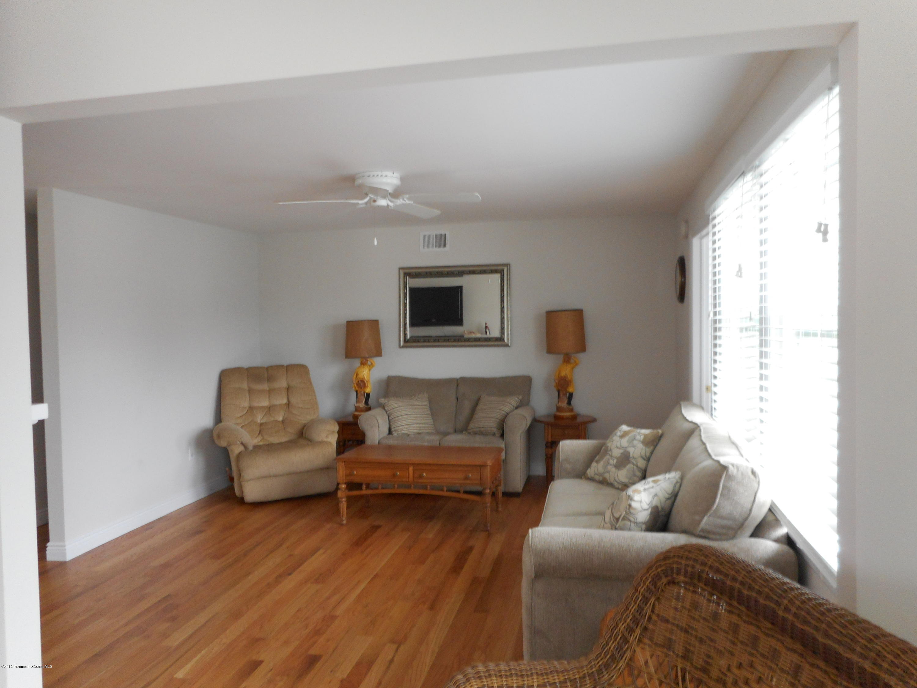 712 Drum Point Road Brick, NJ 08723 - Photo 8 of 23 a living room with furniture and a window