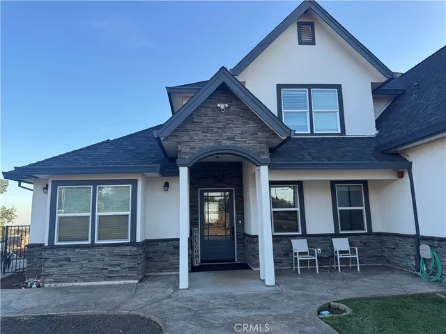 a front view of a house with chairs