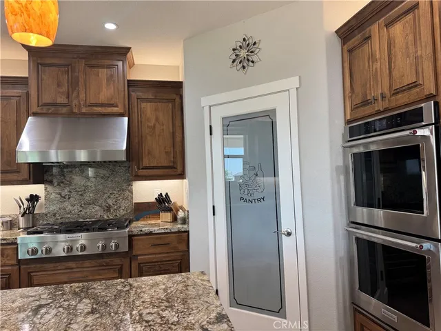 a living room with a table and a potted plant