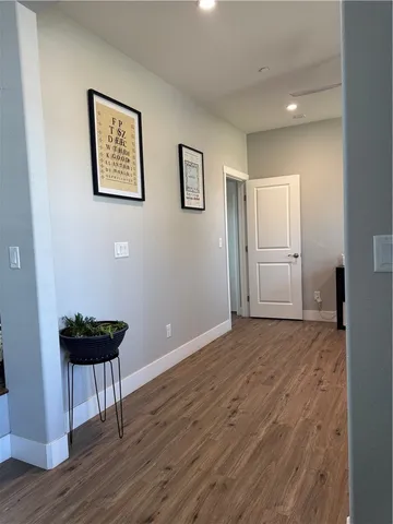 a bathroom with a granite countertop toilet and a sink