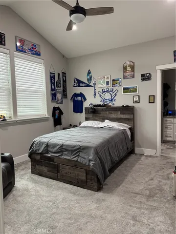a bathroom with a granite countertop toilet a sink and a mirror