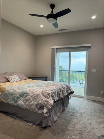 a view of a balcony with lake view and wooden floor