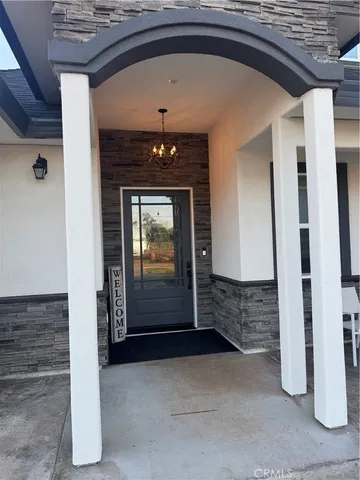 a view of hallway with stairs and wooden floor
