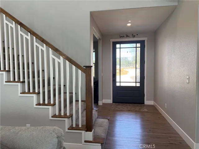 a living room with furniture fireplace and a window