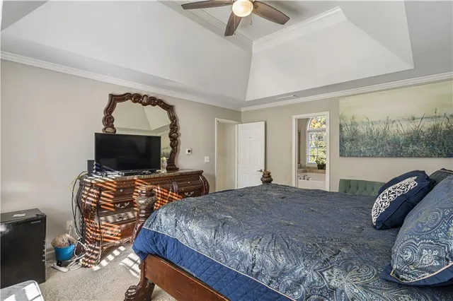 a view of walk in closet with clothes