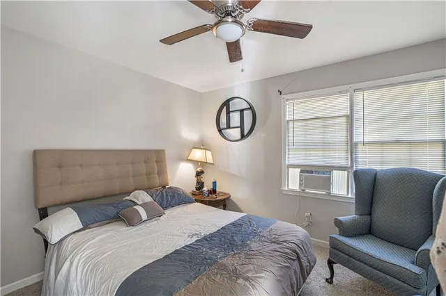 a bedroom with a bed a desk and chair