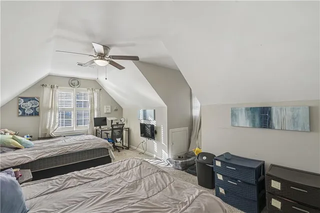 a bathroom with a double vanity sink mirror and toilet