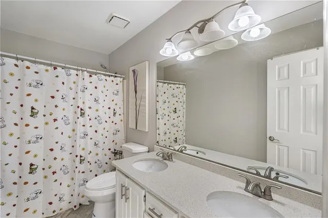 a livingroom with a couch and a window