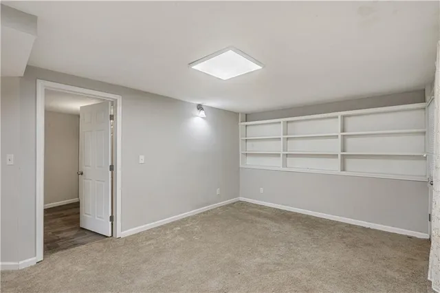 a bathroom with a toilet and a bathtub