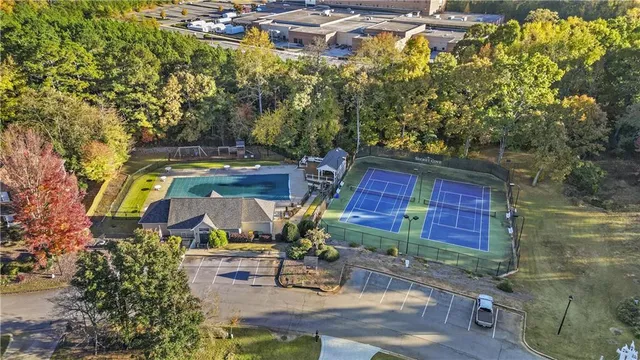 a view of an house with backyard space and wooden fence