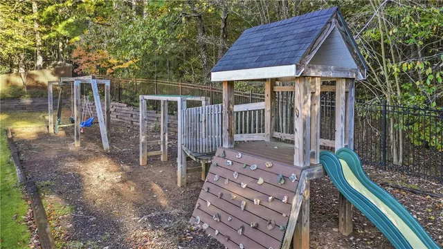 a front view of house with yard outdoor seating and barbeque oven