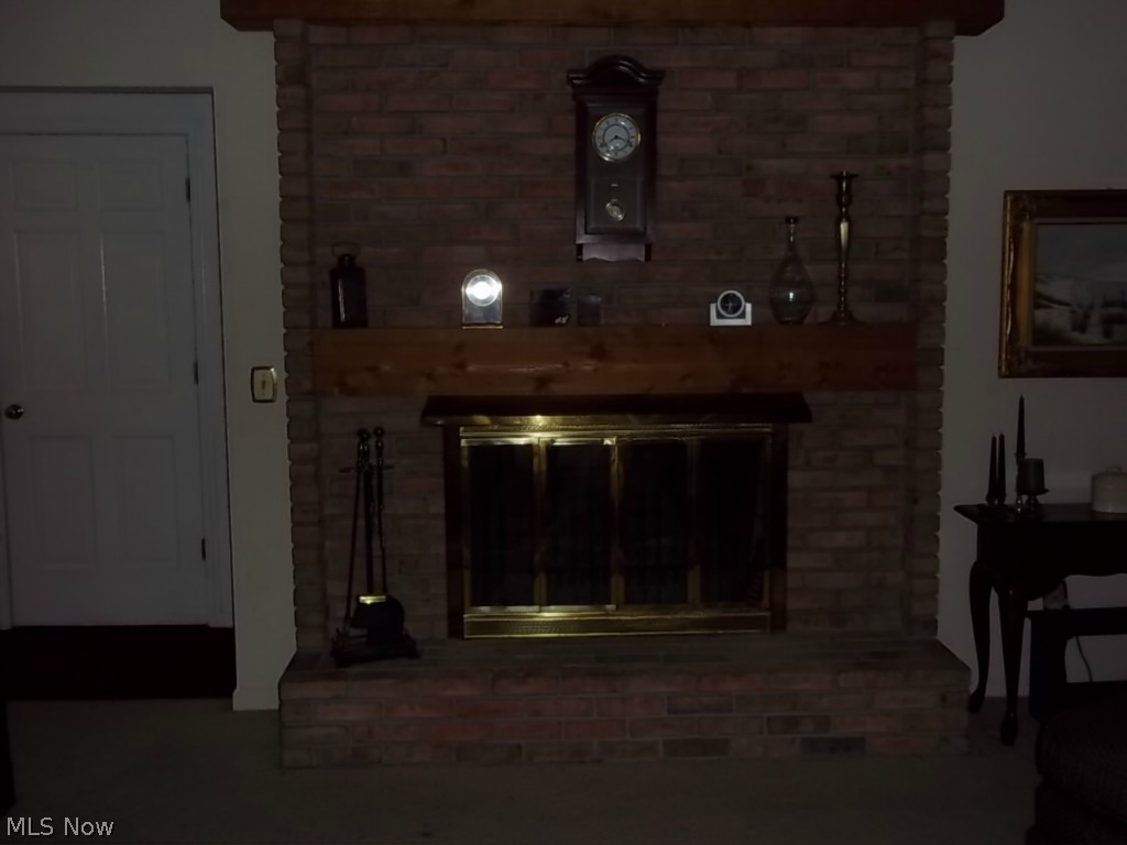 786 Stoner Road Clinton, OH 44216 - Photo 6 of 17 Wood burning fireplace in living room