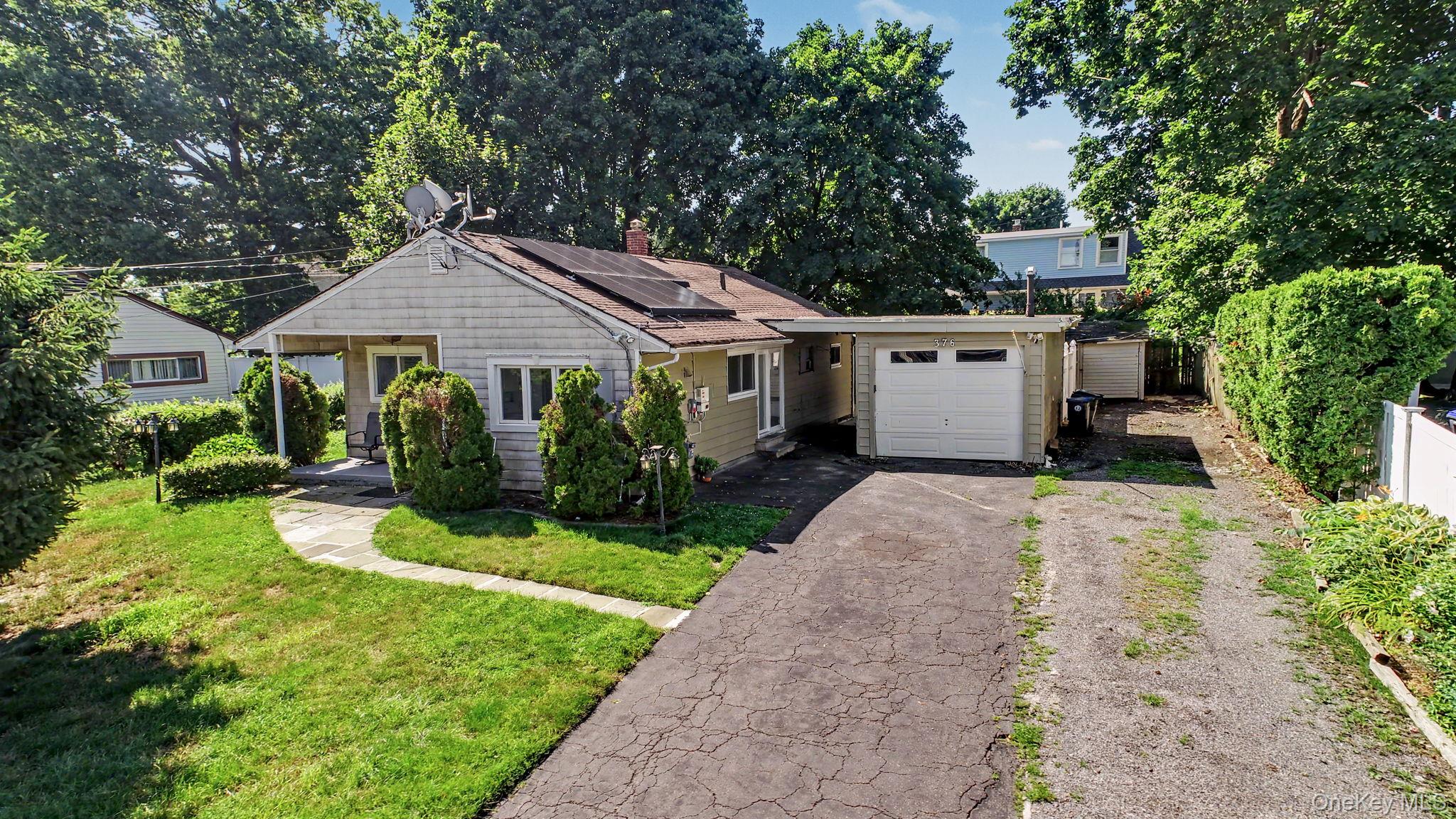 376 County Center Road White Plains, NY 10603 - Photo 1 of 40 Home view with plenty of parking and a workshop.